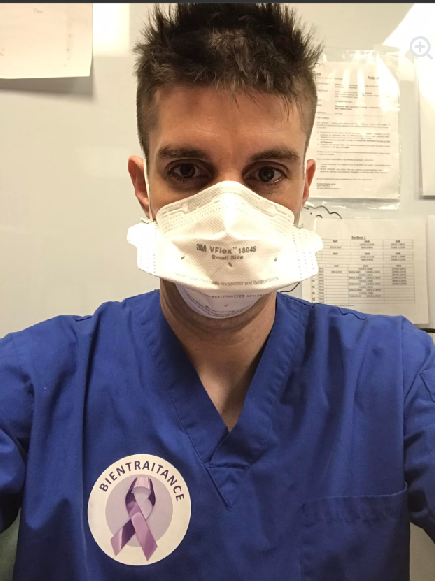 Vincent in scrubs during clinical practice
